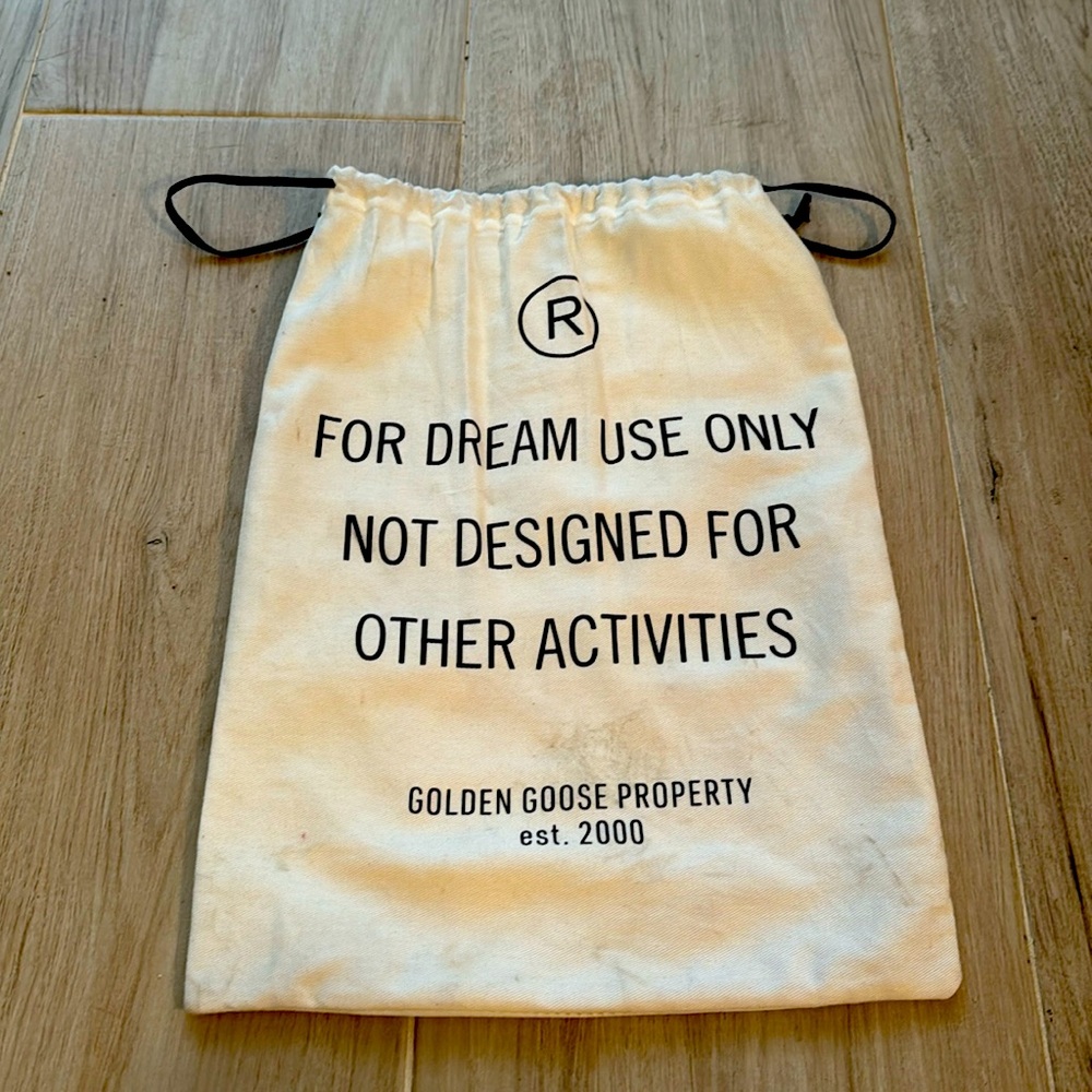 Golden goose dust shoe bag.